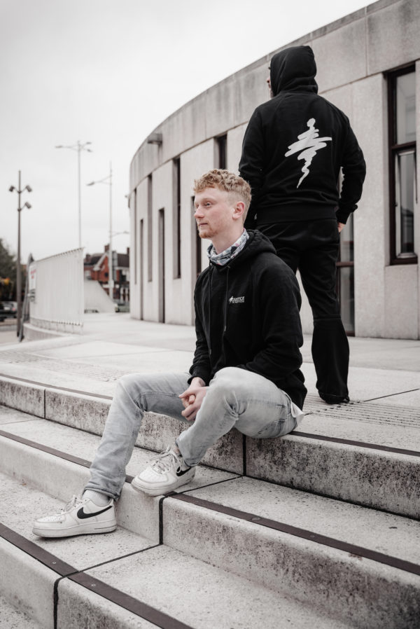 Unisex organic cotton hoody showing back and front with Justice in Motion branding