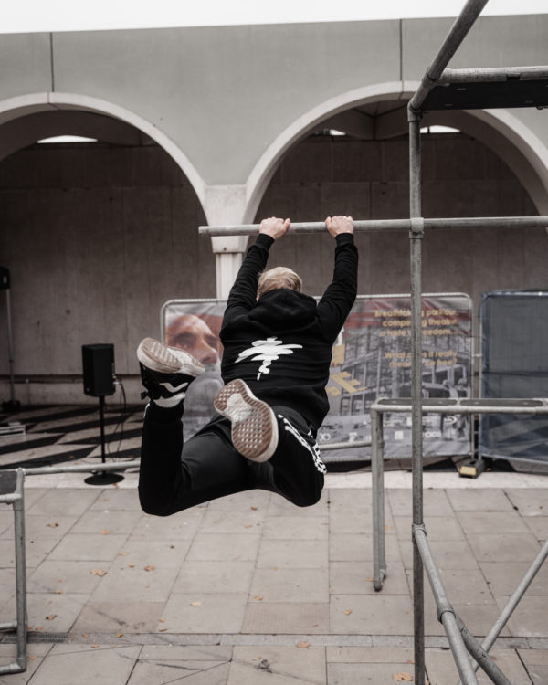 Unisex organic cotton hoody showing the back with the Justice in Motion figure